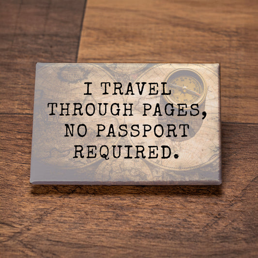 Decorative sign with text 'I travel through pages, no passport required.' on a wooden surface.